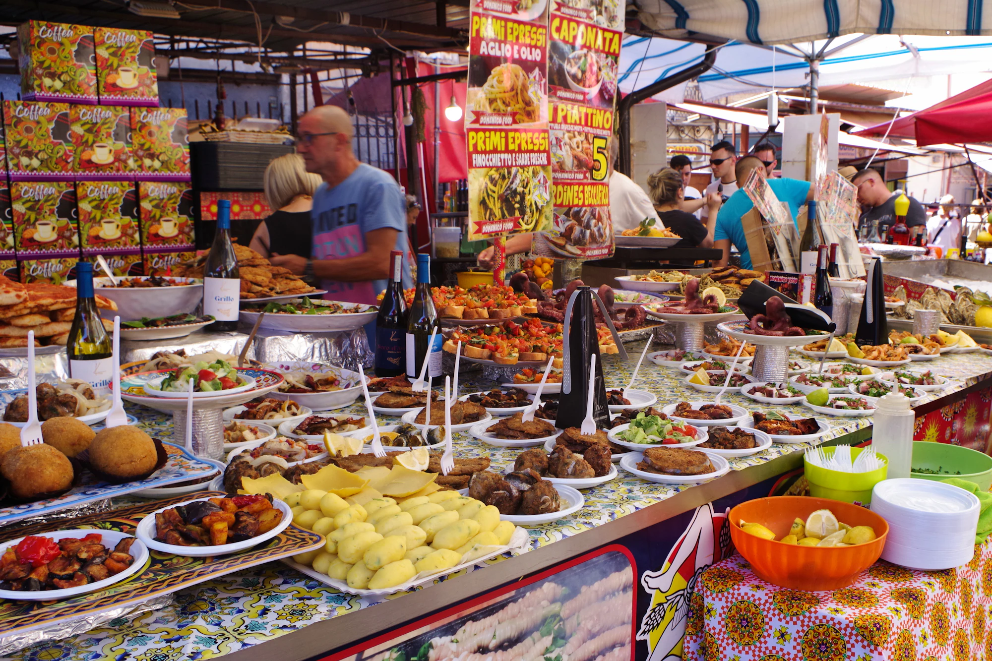 A food stand with many plates of food on it