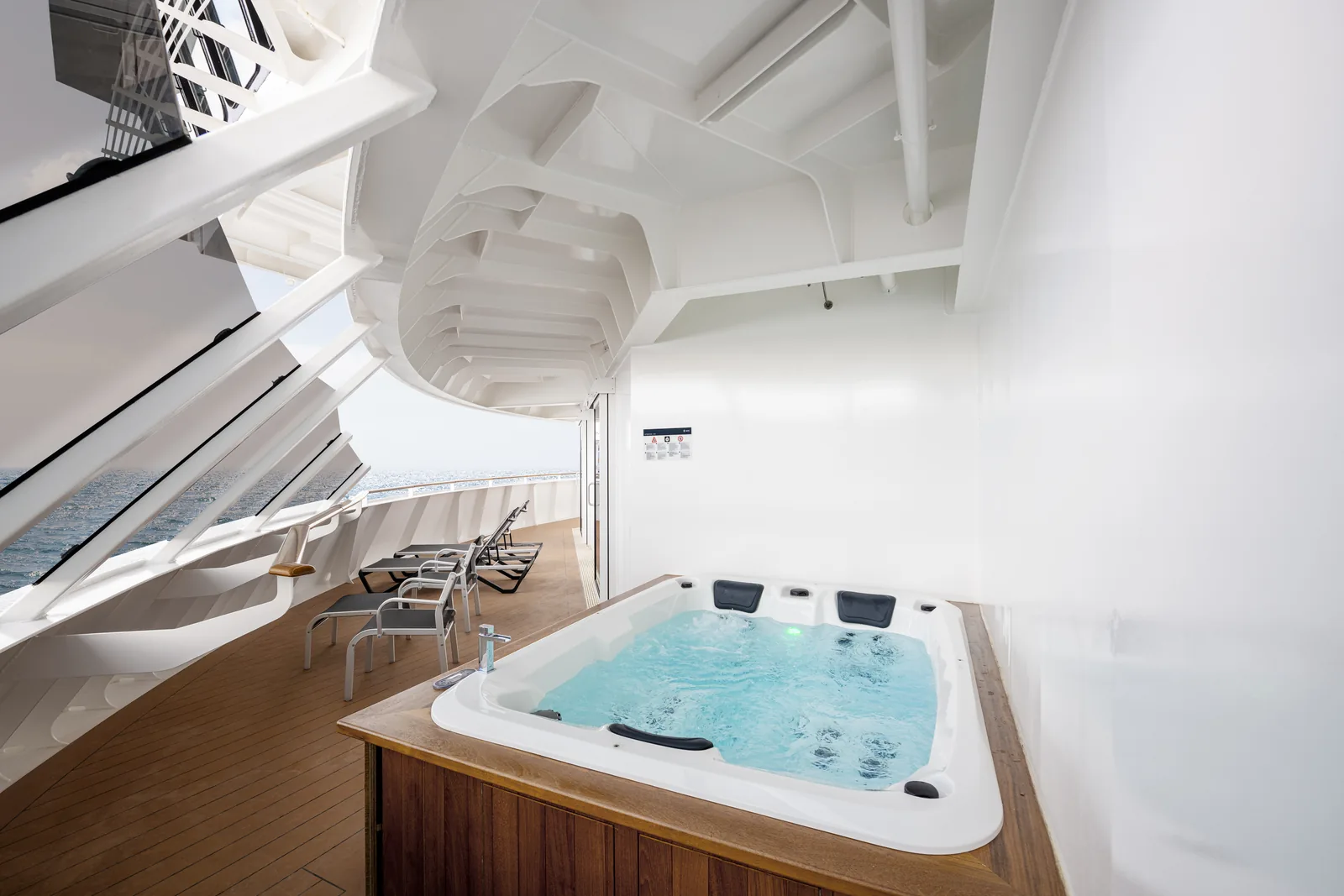 An MSC Aurea experience suite with a private terrace and whirlpool bath