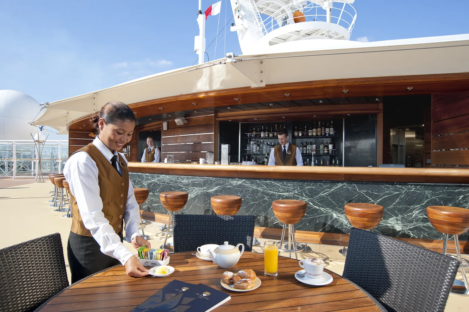 The MSC Yacht Club pool bar and outdoor deck